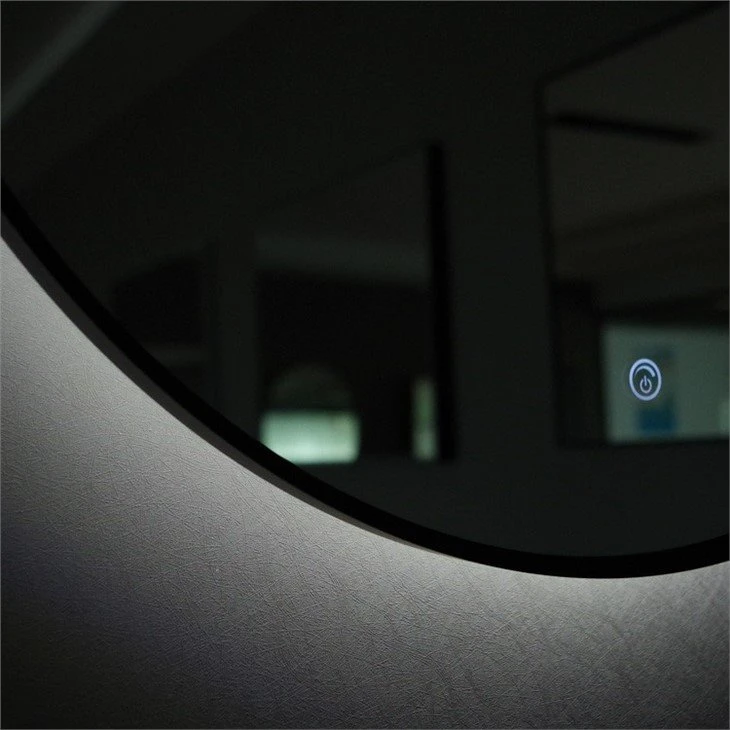 round mirror with light behind 3